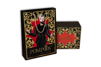 Boîte cadeau noire et sac en papier avec ornements dorés et détail rouge