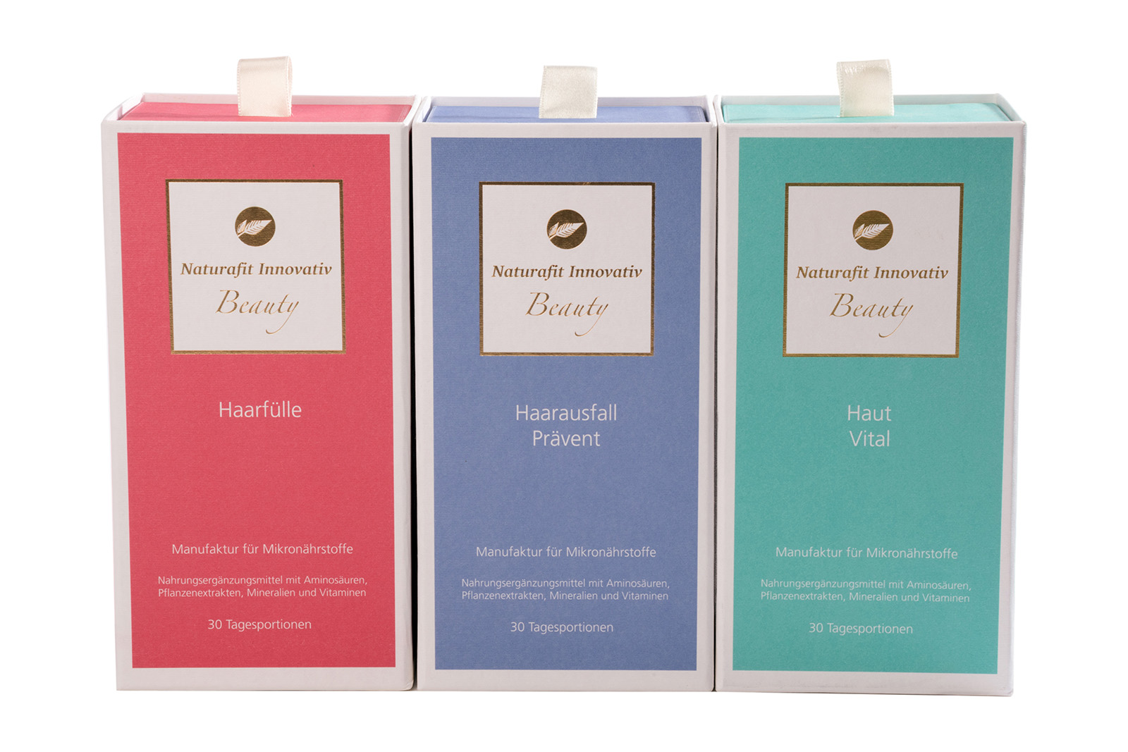 Trois boîtes d'emballage colorées pour compléments alimentaires de différentes couleurs